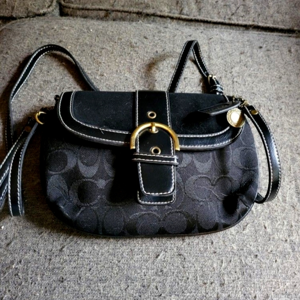 Black Crossbody Bag with Gold Accents and Hobo Shape